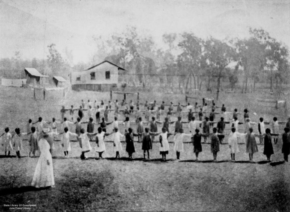 Children at drill outside the settlement school